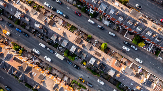 Aerial view of rows of UK terraced houses, illustrating the housing stock that must be upgraded to meet the new Decent Homes Standard and 2030 energy efficiency targets.