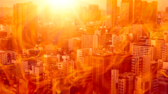 UK residential apartment blocks under an intense heatwave, illustrating overheating risk assessed under CIBSE TM59:2026